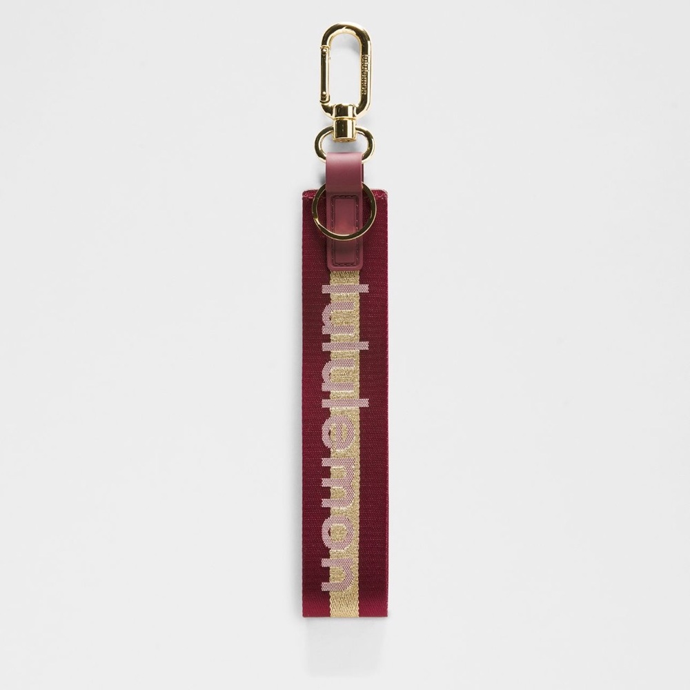 Lululemon | never lost keychain | deep luxe wordmark